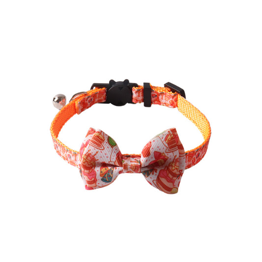Birthday party orange cat collar with removable bow tie on white background