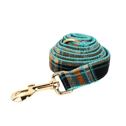 Black teal and orange plaid dog leash with gold clasp detail product shot white background
