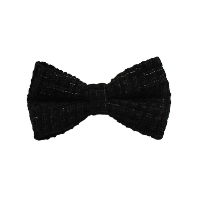 Close-up of a Bling Fuzzie black tweed detachable dog bow tie, showing the classic woven texture with subtle sheen on a white background