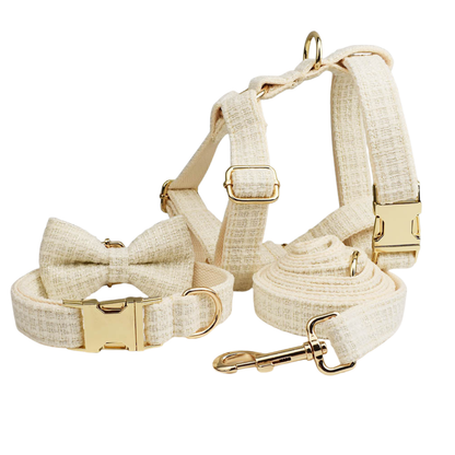 Classic cream tweed dog 4-piece set with detachable bow tie flat lay product shot