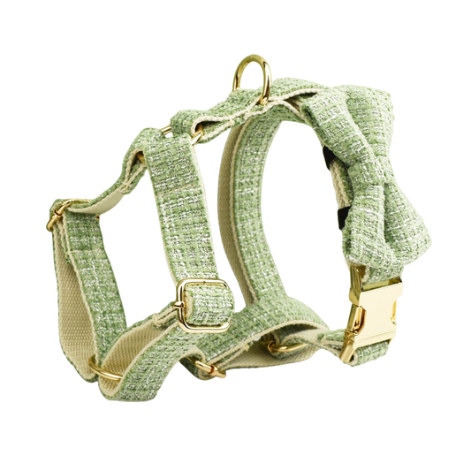 Classic sage green tweed dog harness with detachable bow tie and gold hardware close up detail