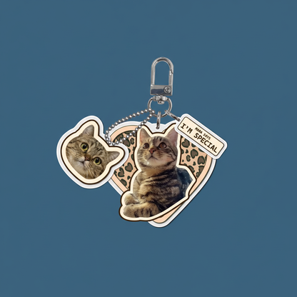 Personalized pet photo keychain tabby cat with leopard print heart charm and custom text mama says im special on dark blue background