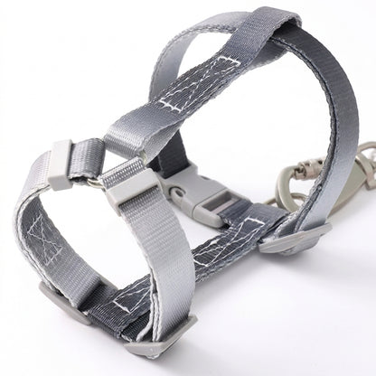 Close-up of a Bling Fuzzie grey black escape-proof H-style step-in cat harness, showing the adjustable straps, dual-lock buckle, and zinc alloy clasp on a white background