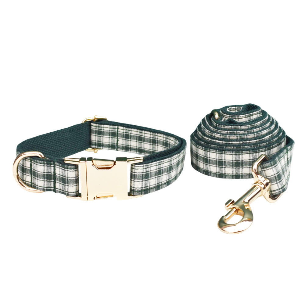 Matching forest green and cream plaid dog collar and leash with elegant gold-tone hardware