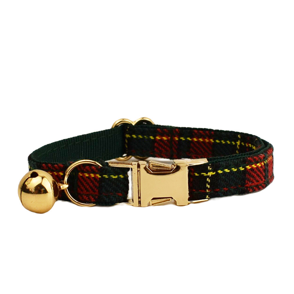 Adjustable forest green tartan cat collar featuring red plaid accents, gold-tone buckle and matching bell on white background