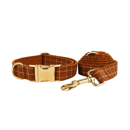 Matching gingerbread plaid dog collar and leash set featuring gold-tone hardware