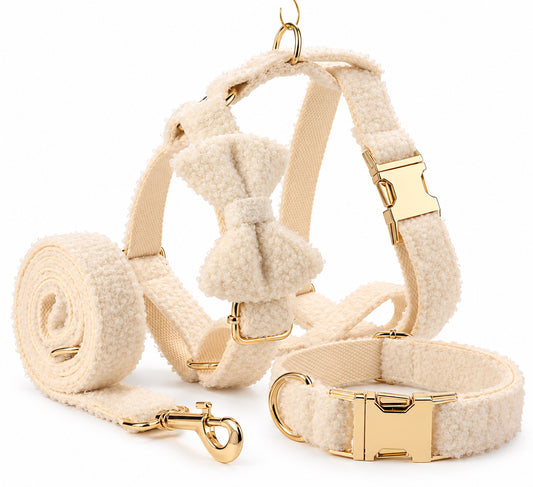 Ivory teddy fleece dog walking set featuring a matching harness, collar, bow tie and leash with gold-tone hardware.