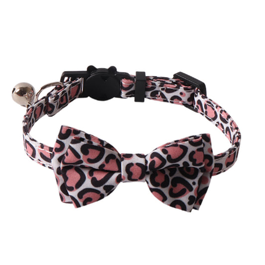 Pink leopard print cat collar with removable bow tie on white background
