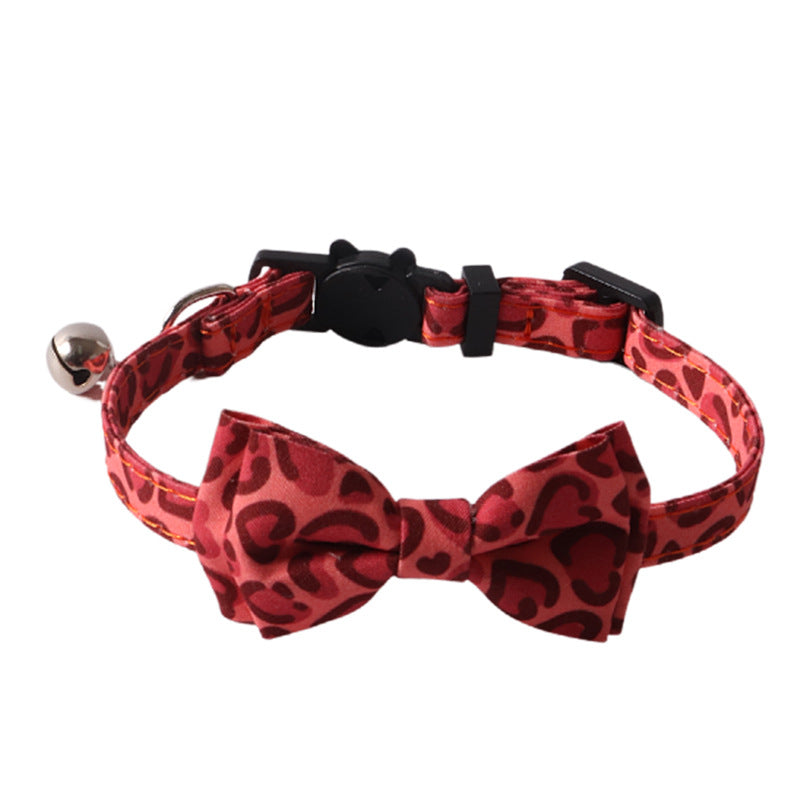 Red leopard print cat collar with removable bow tie on white background