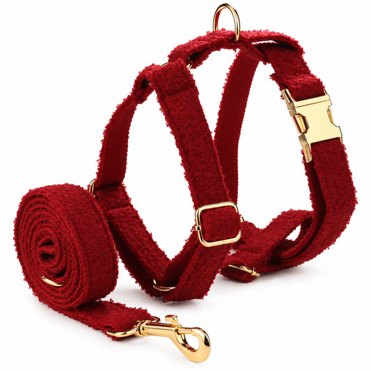 Matching red teddy fleece dog harness and leash set featuring adjustable straps and elegant gold-tone hardware.
