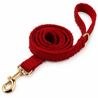 Red teddy fleece dog leash with a gold-tone metal clasp and matching loop handle on a white background.