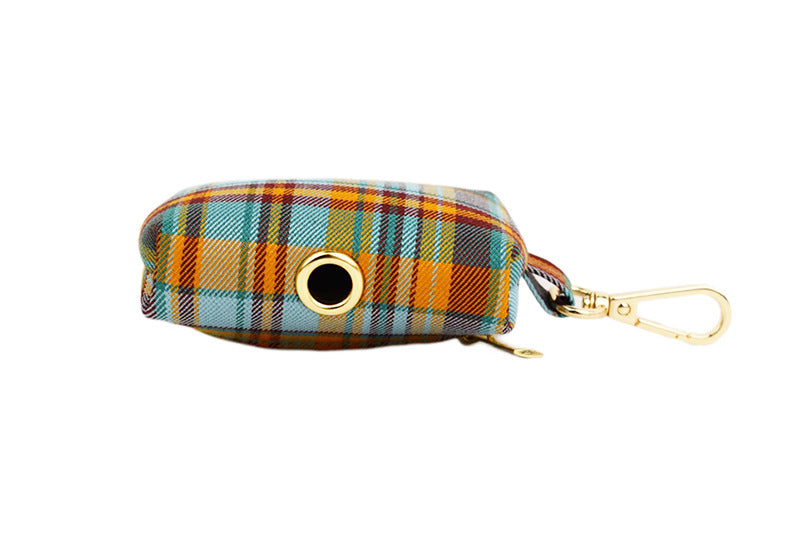 Teal and mustard plaid dog poop bag holder dispenser hole with gold clasp detail product shot
